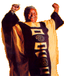 A Person in an African Cape With Hands Raised