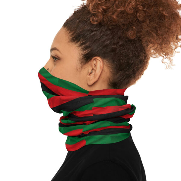 The Side View of a Man in a Flag Themed Scarf