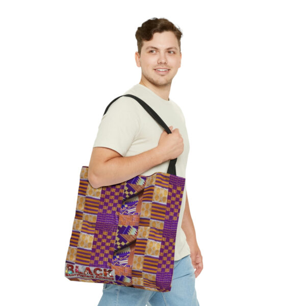 A Man Carrying a Colorful Cloth Pattern Tote Bag