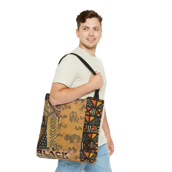 A Man Carrying a Tribal Printed Tote Bag